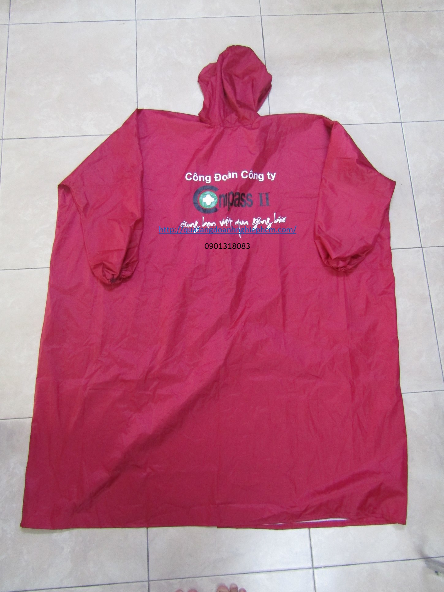 công ty sản xuất gia công áo mưa in logo theo yêu cầu công đoàn công ty COMPASS 2